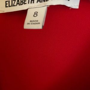Gorgeous NEW w/out tags sheath with bell sleeves by Elizabeth and James.